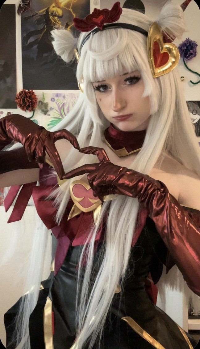 Lele making a heart shape with her hands